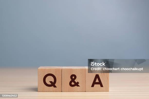 Wood Block Cube With Alphabet Qa On Wooden Tablequestions And Answers Concept Stock Photo - Download Image Now
