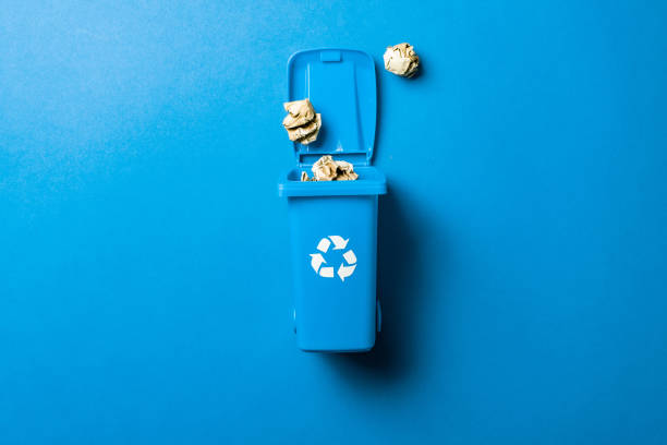 istock Recycling icon. Bin container for disposal garbage waste and save environment. Blue dustbin for recycle paper trash isolated on blue background. 1308463573