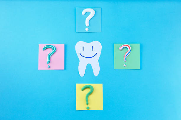 istock Symbol of question mark from toothpaste on blue background, 1308464133