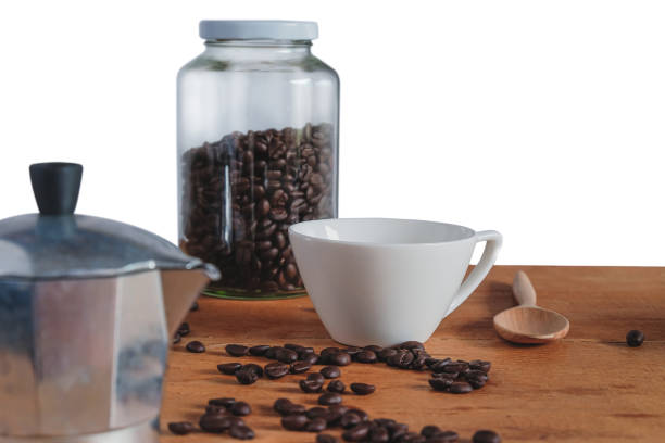 istock Moka pot coffee maker with fresh coffee bean on table. 1308464818