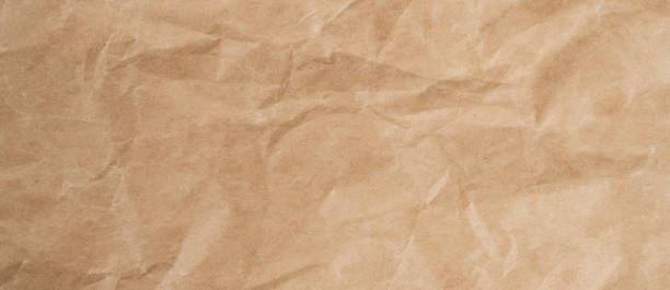 istock Close up crumpled brown paper texture and background with copy space 1308465306
