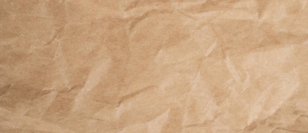 istock Close up crumpled brown paper texture and background with copy space 1308465320