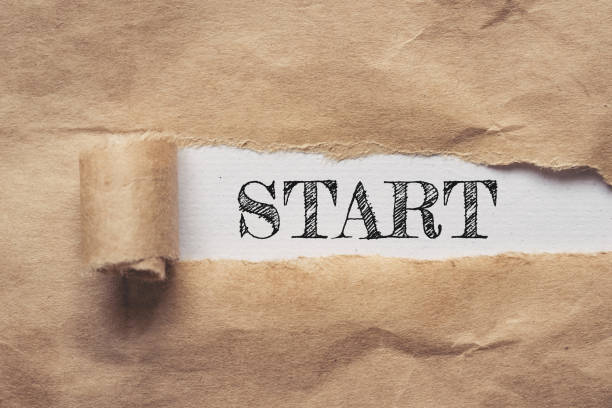 istock Business and finance. Torn brown paper on a white background, the text - Start 1308465355