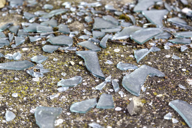 Broken glass to pieces in street, vandalism and crime, occupation