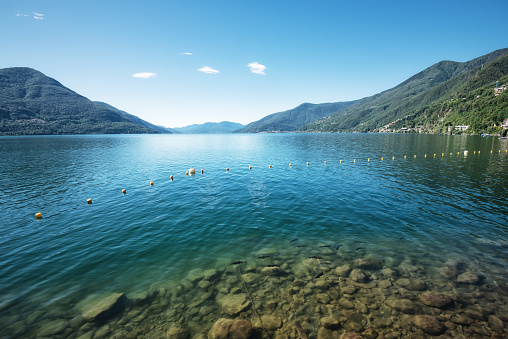 Panoramic view over lake Maggiore in Switzerland. Let’s have a swim in the refreshing clear water.