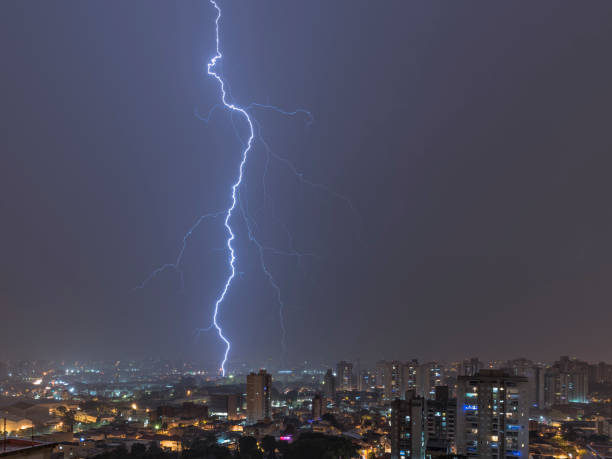 istock Lightnings in a stormy night in the city 1308474778