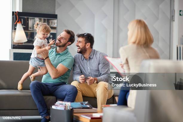 Gay Fathers Enjoying In Shopping And Having Fun With Child Girl Stock Photo - Download Image Now