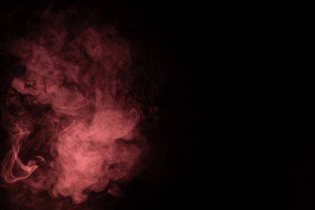 istock Green and pink steam on a black background. 1308475154