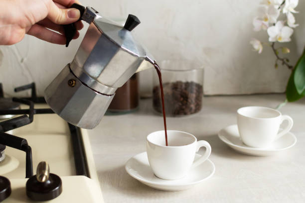 istock Coffee is poured from the geyser coffee maker into the espresso cup. 1308475163
