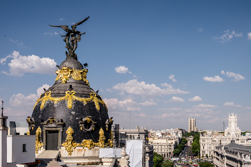 Close-up of famous dome in the center of Madrid. Plaza de Cibeles, town hall, Bank of Spain, Puerta de Alcalá, Palacio de Linares, traffic.