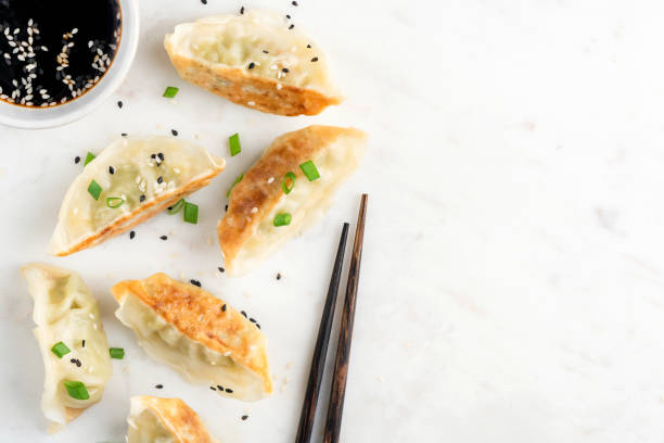 istock Fried Gyoza or Jiaozi on marble background 1308478999