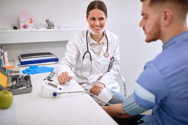 istock Doctor with patient in office 1308480361