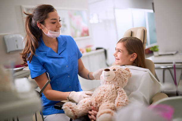 istock Smiling child in dental chair 1308481658