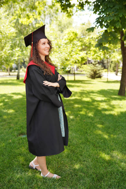 istock Graduation, Pretty Recent Graduate outdoors near university 1308483049