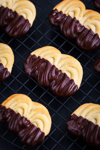 istock Homemade chocolate dipped shortbread cookies on dark background 1308483784