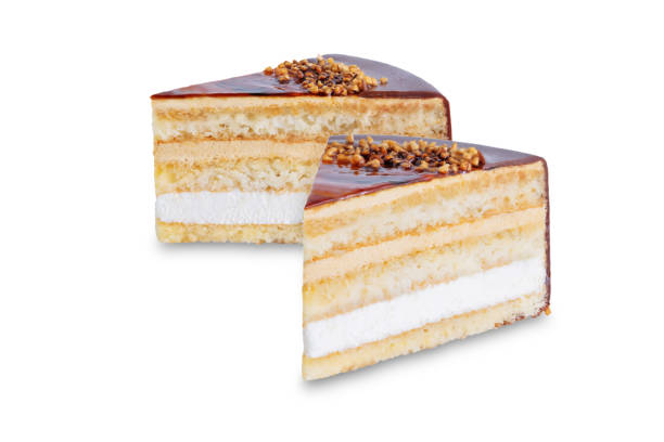 istock Caramel cake decorated with nuts on a white isolated background 1308486448