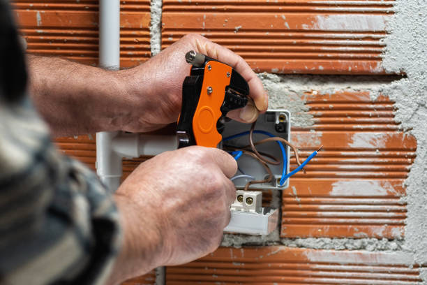 istock Electrician at work on a residential electrical system. Electricity. 1308488028