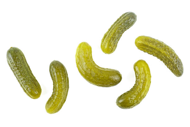 istock Set of delicious marinated pickled cucumbers isolated on a white background, top view. 1308488525