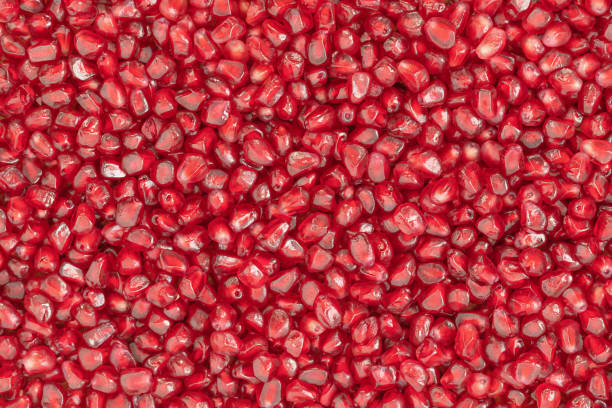 pomegranate seeds background - romã imagens e fotografias de stock
