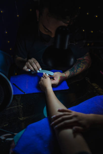istock Manicurist working in a woman's hands 1308490592