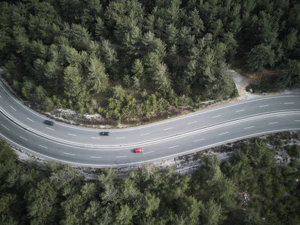 istock Red color challenge ,Vehicles going on mountain winding road roads 1308492352