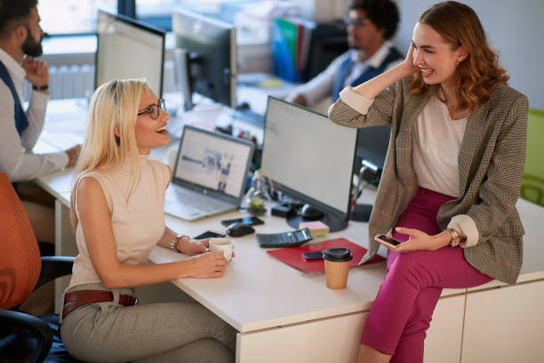 istock casual business woman having a good time at work . 1308492388