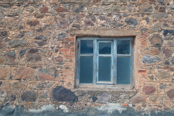 Old heaped stone wall full frame texture background.