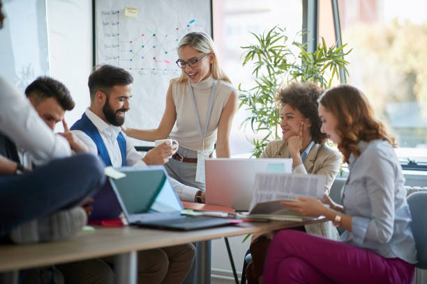 istock Coworkers  working together as team and discussing ideas 1308493452