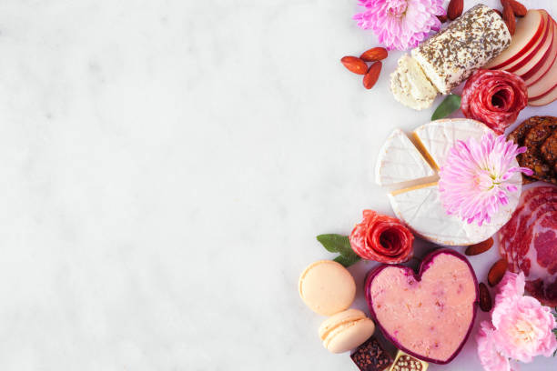 istock Mother's Day charcuterie side border against a white marble background 1308496544