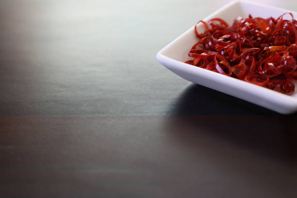 Pictured dried chili cutting in round slices.