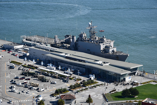 San Francisco, CA, USA - October 7, 2019: The USS Pearl Harbor (LSD 52) and the James R. Herman Cruise Terminal at Pier 27 in the Port of San Francisco.
