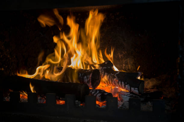 istock Yellow and Orange Fireball, heating up the black background. 1308502403