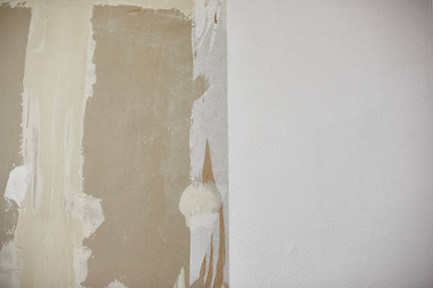 istock plasterboard wall, plastered with white plaster, white wallpaper on the wall, renovation in the interior 1308502807