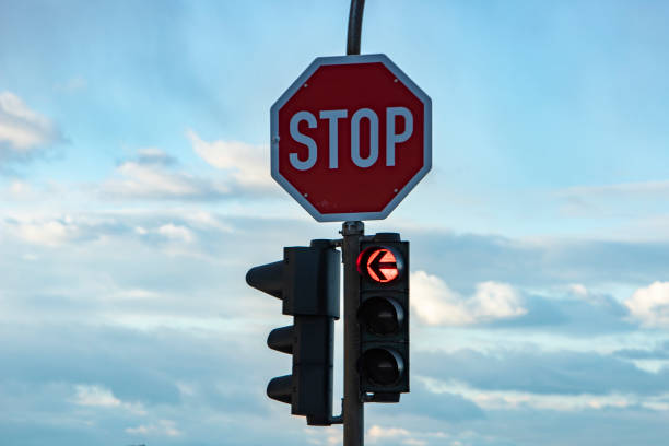 istock German stop sign and a traffic light showing red, arrow to the left 1308504573