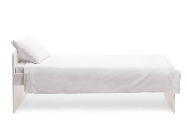 istock Studio side shot of a white single bed with duvet 1308505470
