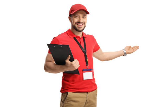istock Male shop assistant gesturing welcome 1308505473