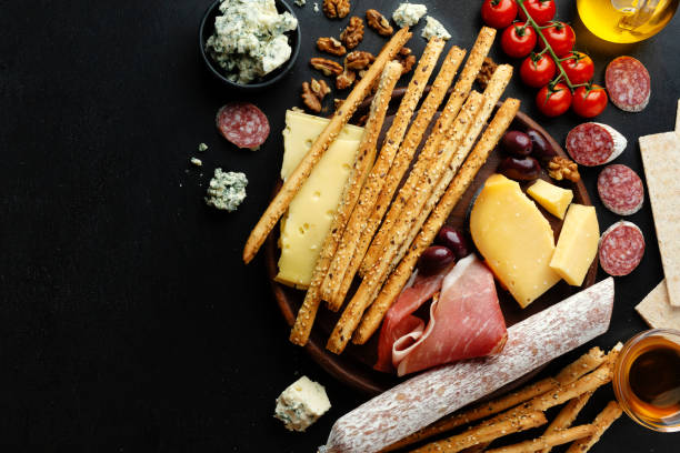 istock Tasty classic italian appetizers on dark background 1308506963