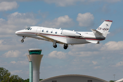Farnborough, UK - July 19, 2014: NetJets Cessna 560XL (Cessna Citation Excel) business jet CS-DXP departing Farnborough Airport.