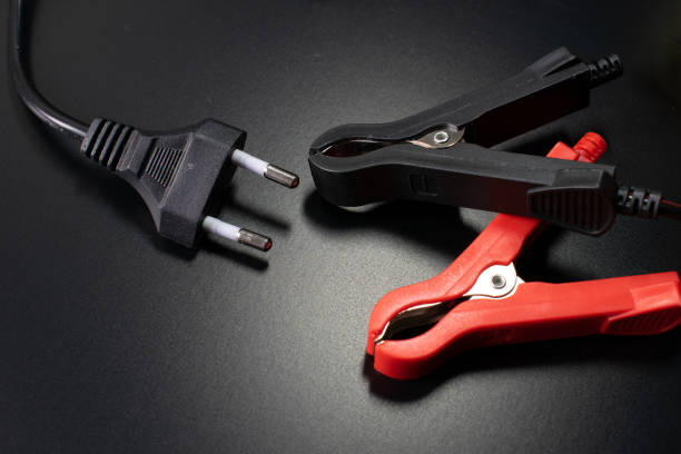 istock electrician tools on black background, digital multimeter on black background 1308510029