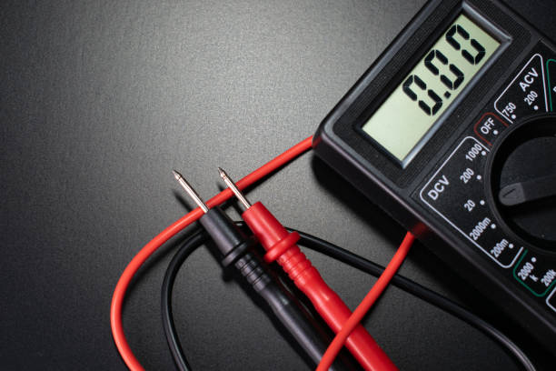 multimeter, electrician tools on black background, digital multimeter on black background Multimeter on a dark background multimeter stock pictures, royalty-free photos & images