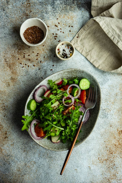 istock Vegetarian salad with arugula and flax seeds 1308512045
