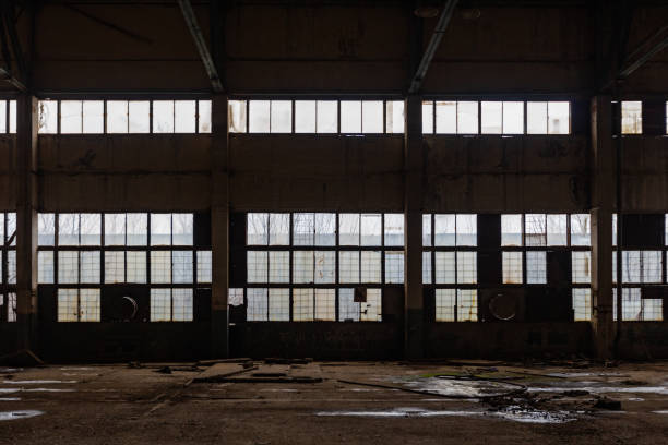 istock Abandoned ruined large industrial hall 1308512805