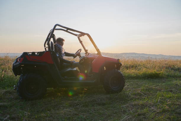 man enjoying beautiful sunny day while driving a off road buggy car