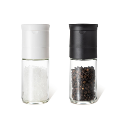 Salt and pepper shakers isolated on white background.