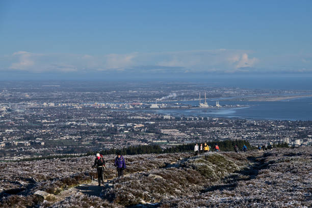 People hiking during coronavirus lockdown to see unusual Irish winter and landscapes of Dublin and Wicklow Mountains stock photo