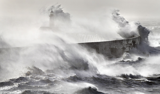 A storm in the English Channel makes  waves that resemble over Newhaven harbour and lighthouse