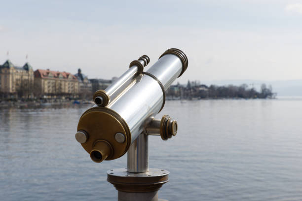 antiques old interesting observation platform binoculars for city and landscape sightseeing made of metal and golden copper, by day, without perons