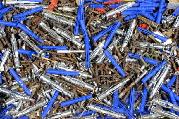 istock Pile of old rusty drive screws and dowels background, texture. 1308517287