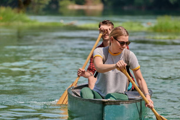 istock friends are canoeing in a wild river 1308517473