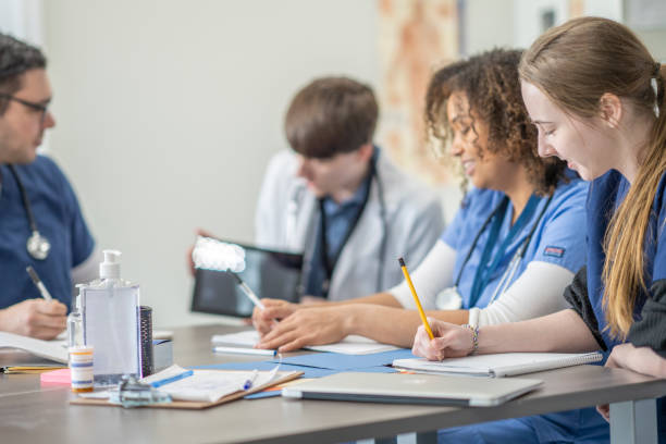 istock Multi Ethnic Group of Students in Medical Training Class 1308520597